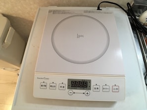 A white induction cooktop with a digital display and control buttons. - Bell Air OKUBO 101 (Tokyo)