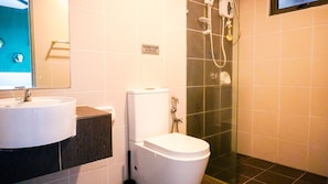 Guests can enjoy a convenient bathroom with a sink, toilet, and shower area.