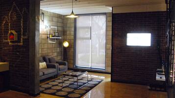 Duplex, 2 Bedrooms (Green Pop) | Living area | Flat-screen TV