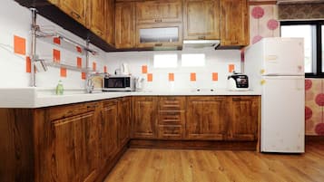 Full-sized fridge, microwave, stovetop, electric kettle
