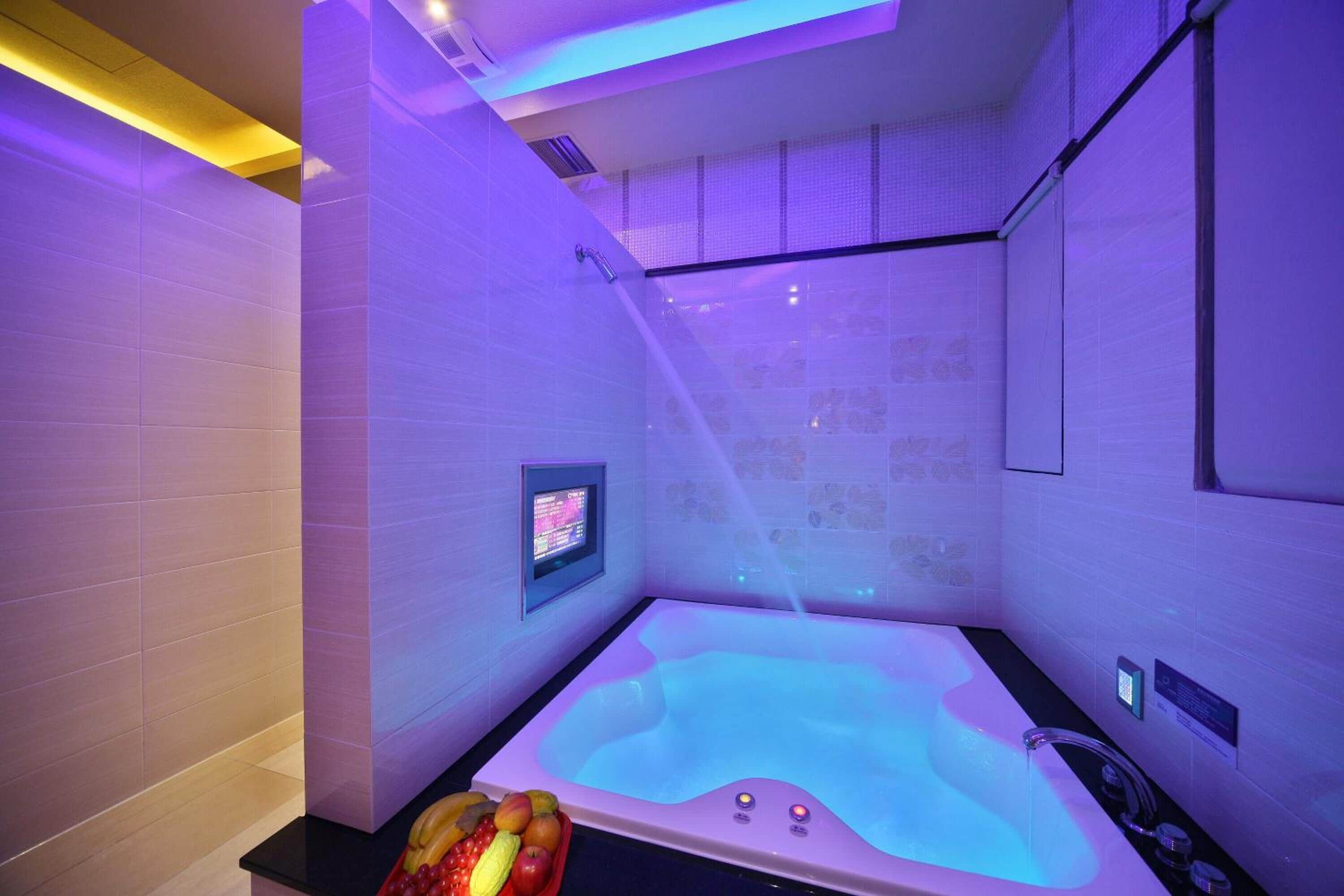 Separate tub and shower, hair dryer, slippers, towels