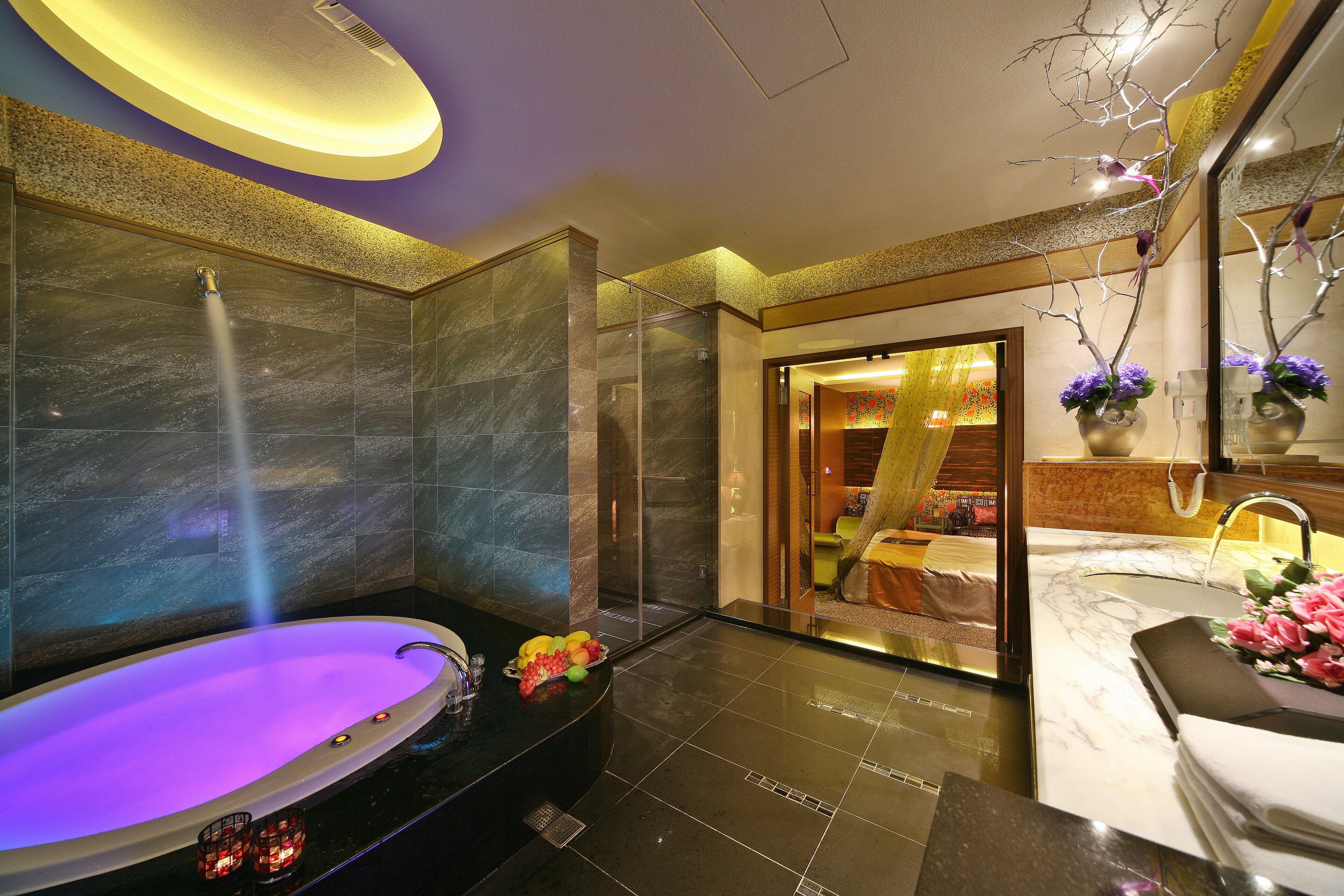 separate bathtub and shower, hair dryer, slippers, towels