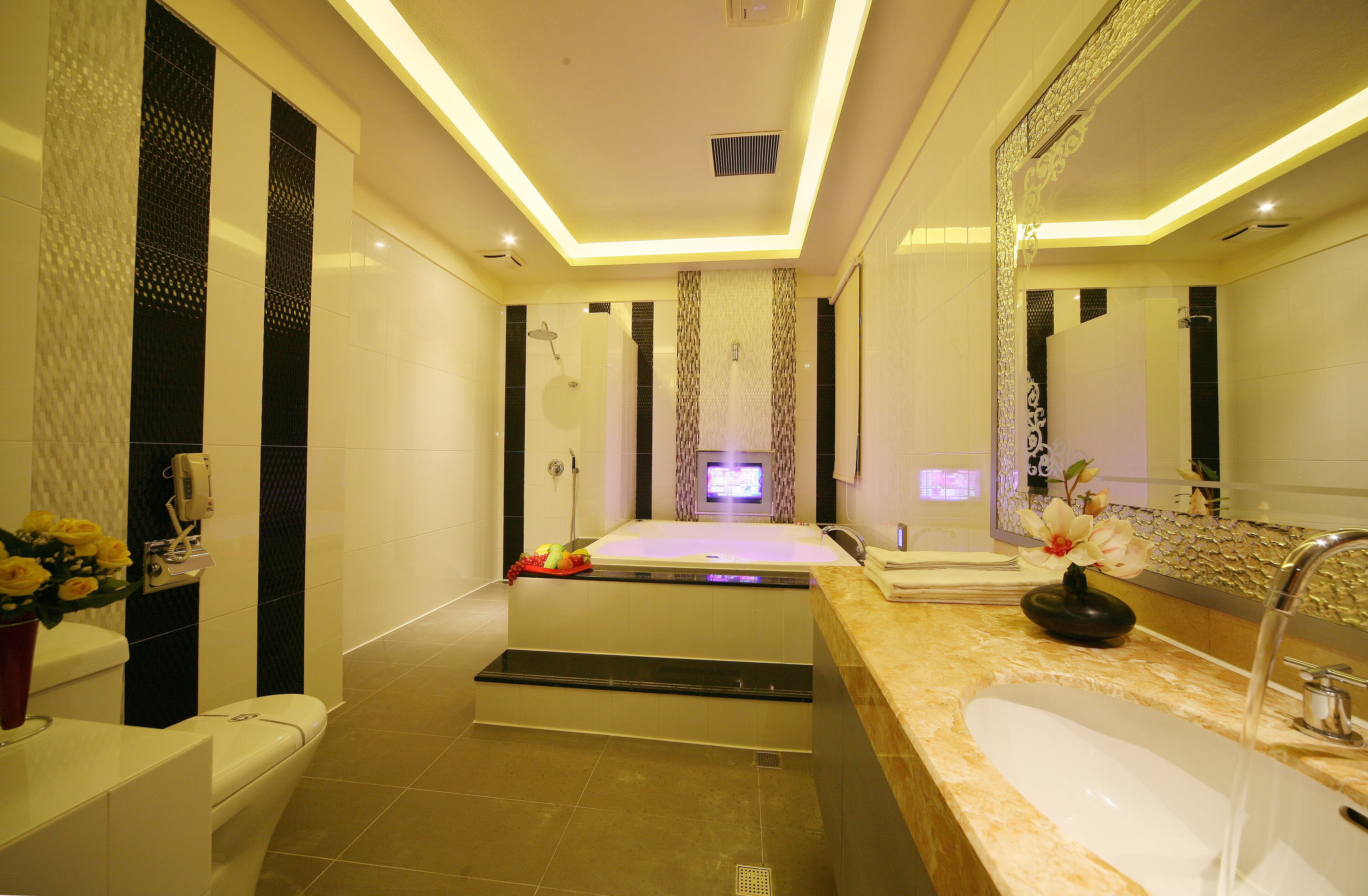 separate bathtub and shower, hair dryer, slippers, towels