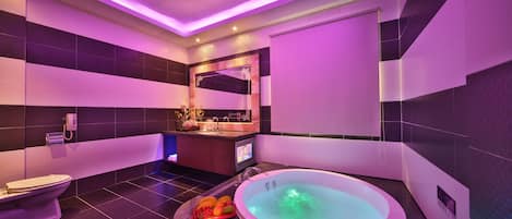 Separate tub and shower, hair dryer, slippers, towels