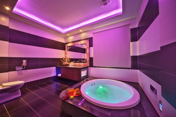 Separate tub and shower, hair dryer, slippers, towels