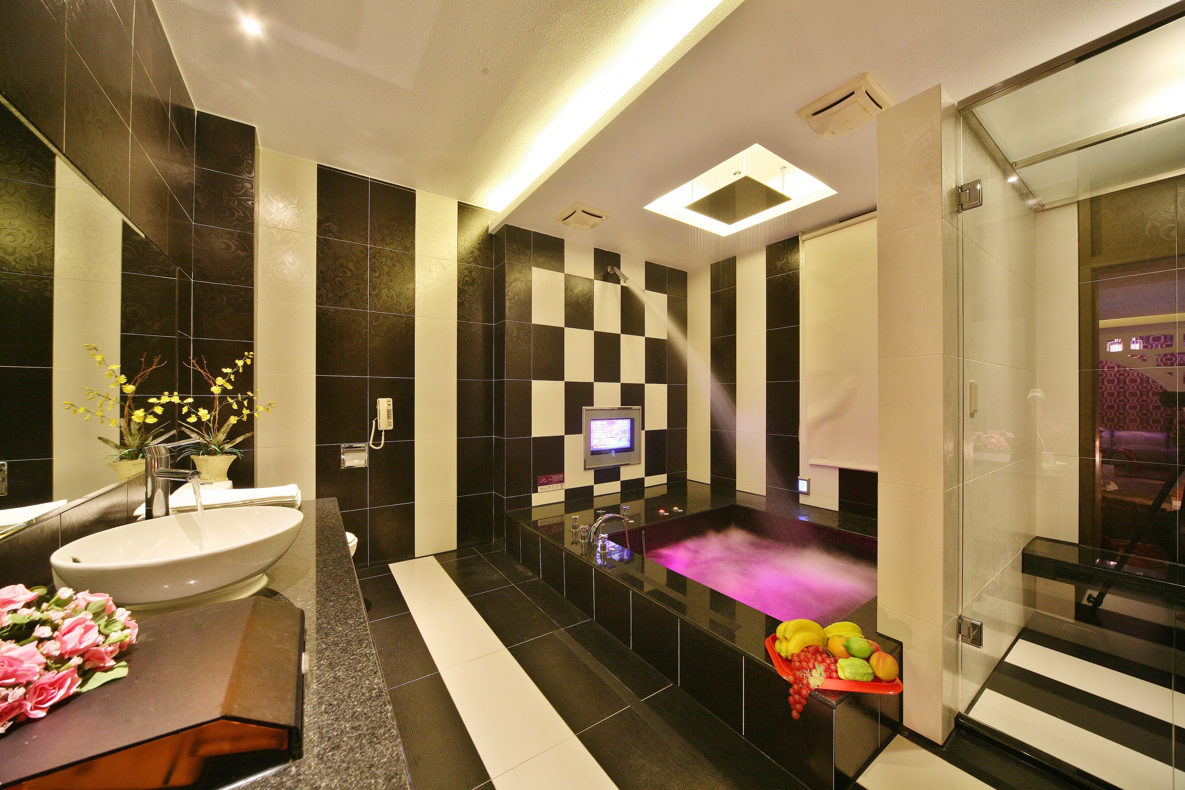 separate bathtub and shower, hair dryer, slippers, towels