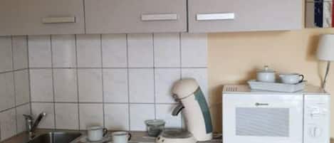 Microwave, coffee/tea maker, cookware/dishes/utensils