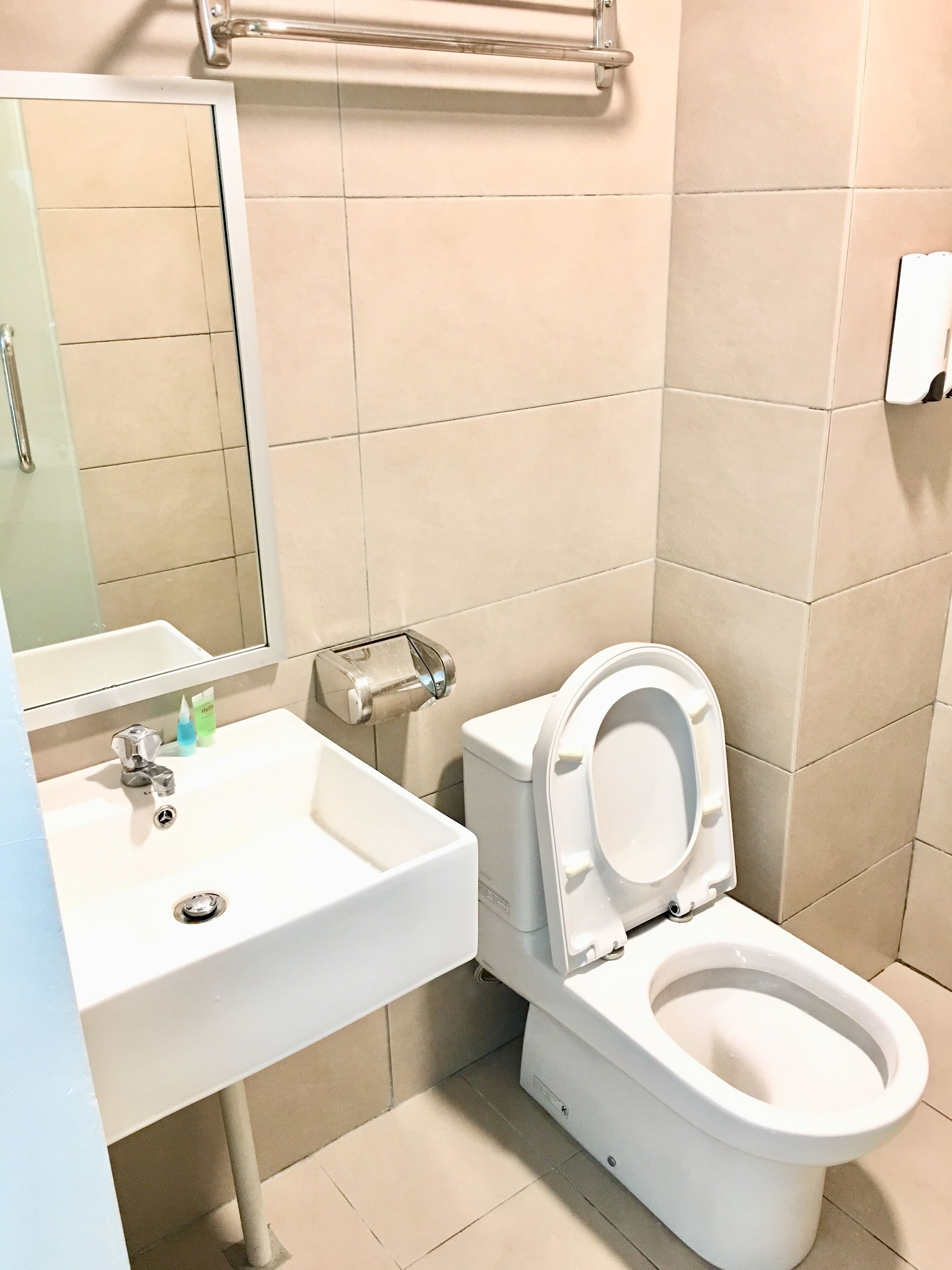 shower, hair dryer, slippers, towels