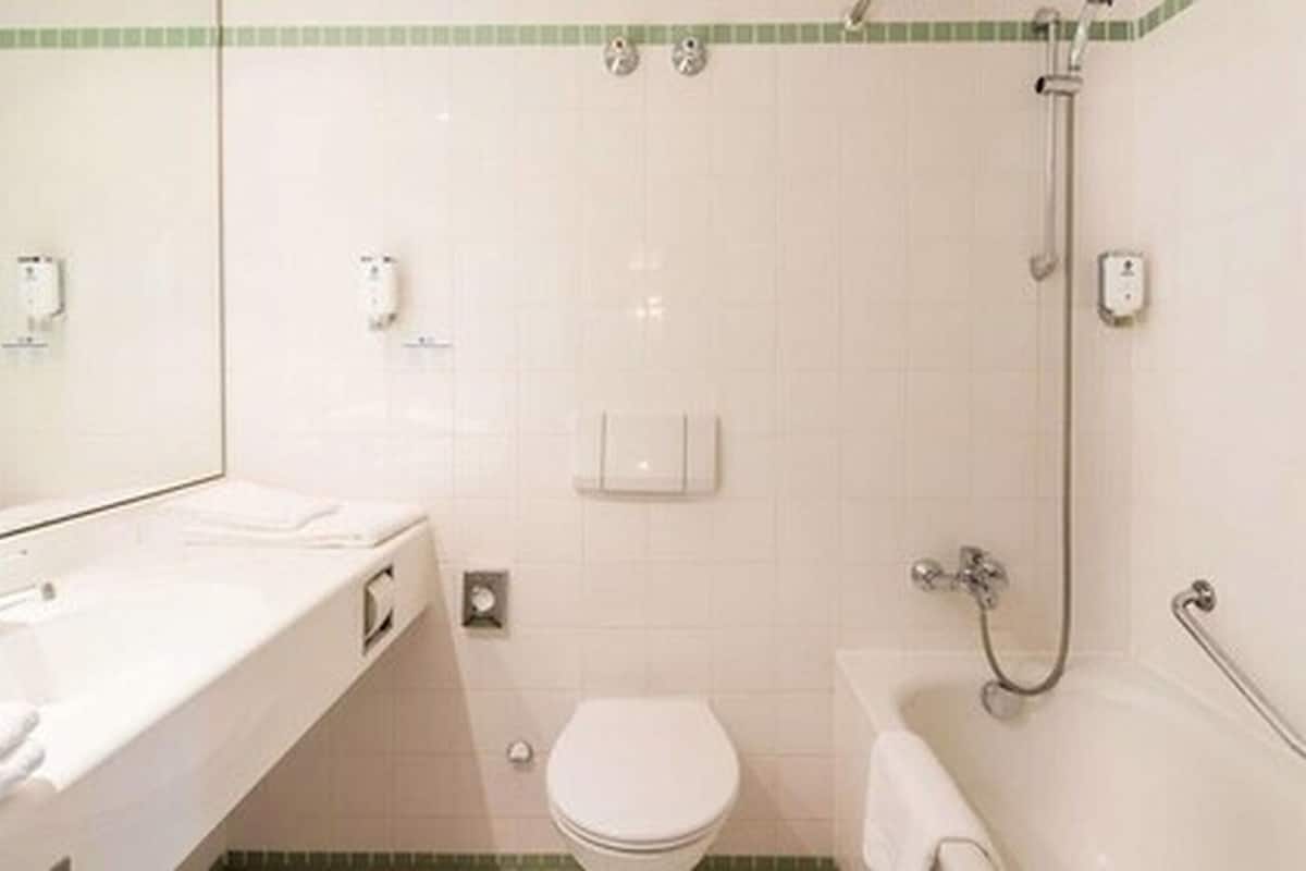 bathtub, free toiletries, towels, soap