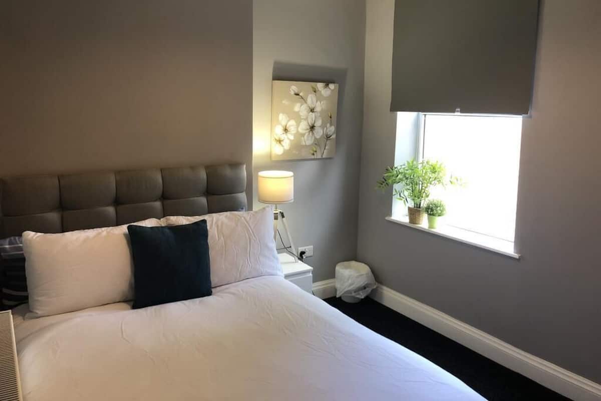 Premium bedding, desk, laptop workspace, bed sheets