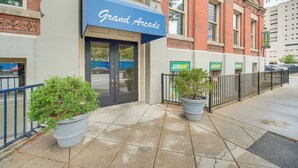A building with a blue awning labeled "Grand Arcade" and a Subway entrance. - Dtwn Cleveland Loft-Style Condo: Walk to Stadiums! (Cleveland)