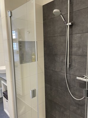 Family Apartment, 1 Bedroom | Bathroom | Hair dryer, towels, soap, shampoo