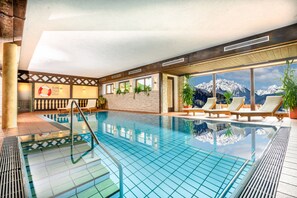 Indoor pool, pool umbrellas, pool loungers
