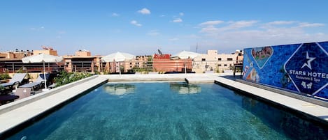 Indoor pool, outdoor pool, open 10:30 AM to 6:30 PM, pool umbrellas