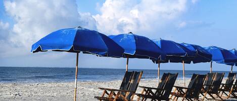 On the beach, sun-loungers