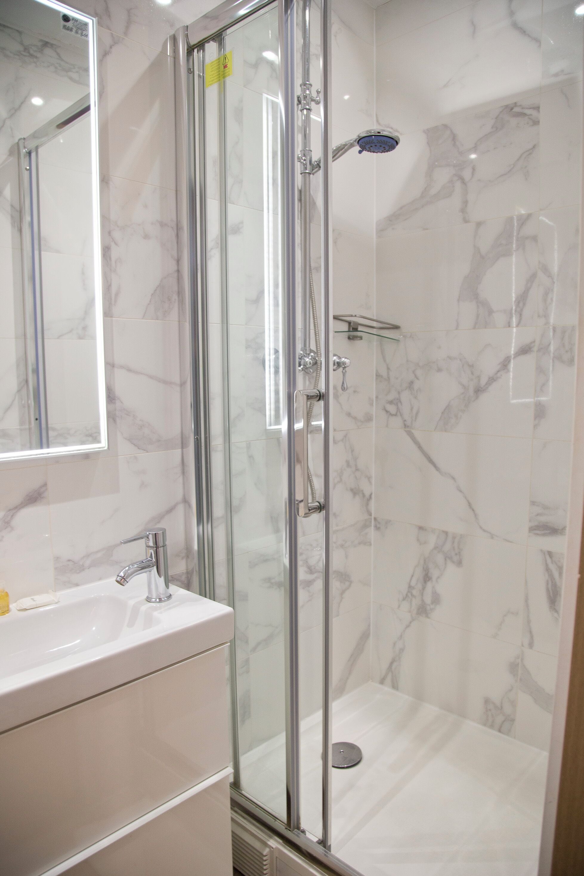 Shower, hair dryer, towels, soap