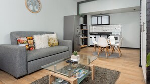 Grand Studio | Living area | Flat-screen TV