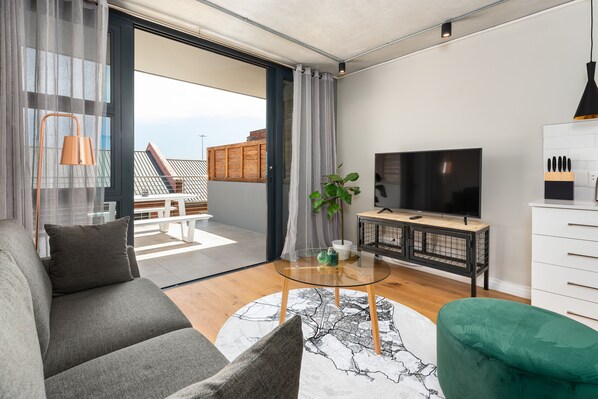 Grand Apartment | Living area | 32-inch flat-screen TV with satellite channels, TV - Docklands 321 (Cape Town)
