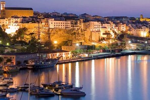 A harbor with boats and buildings along the waterfront. - Modern Villa, Port Views, Jacuzzi & Pool, Full AC (Maó)