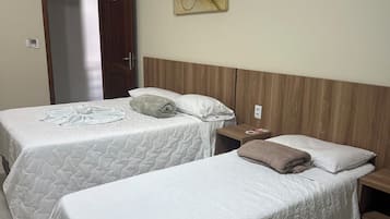 Suite Executiva Familia | Cortinas blackout, Wi-Fi de cortesia, roupa de cama