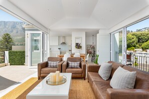Grand House, 2 Bedrooms | Living room | 32-inch flat-screen TV with satellite channels, TV - Queens Road 11B (Cape Town)