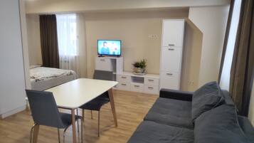 Superior Studio Suite | Living room | 32-inch plasma TV with digital channels, TV