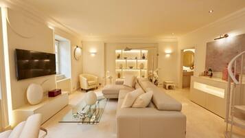 Design Apartment | Living area | Flat-screen TV, heated floors