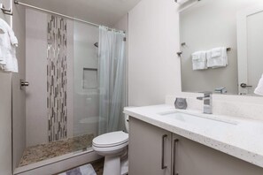 Shower, hair dryer, towels, shampoo