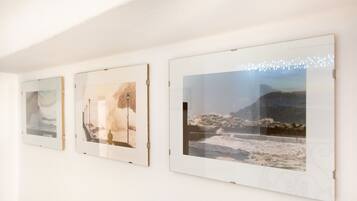 Three framed artworks on a wall.