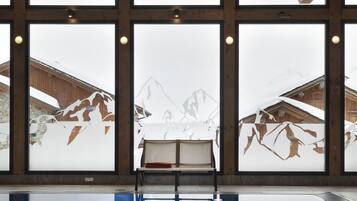 Indoor pool, open 10:00 AM to 8:00 PM, pool loungers
