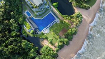 2 outdoor pools, open 6:00 AM to 8:00 PM, pool umbrellas, pool loungers