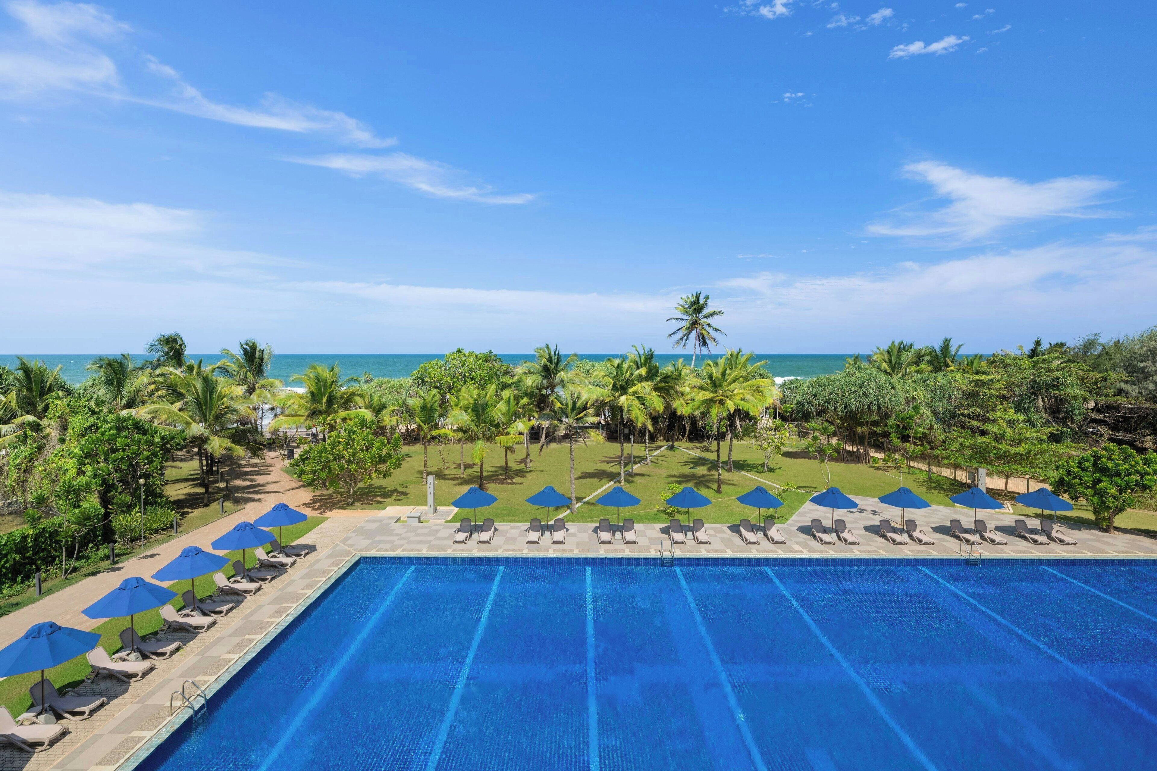 2 outdoor pools, open 6:00 AM to 8:00 PM, pool umbrellas, pool loungers