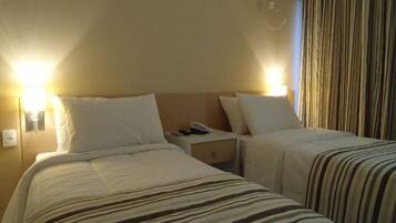 Quarto solteiro standard | Frigobar, Wi-Fi de cortesia, roupa de cama