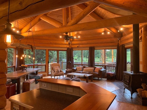 Custom built log home surrounded by lakes