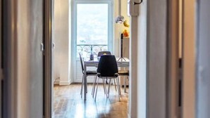 A hallway leading to a dining area with a view of the outdoors. - Bright Airy Spacious Property (Passy)