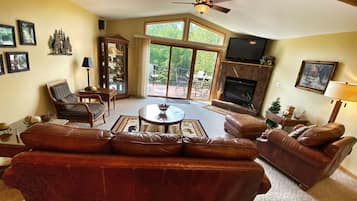 Smart TV, fireplace, books, computer monitors