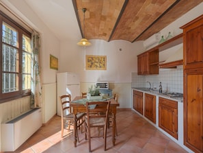 Microwave, toaster, high chair, dining tables