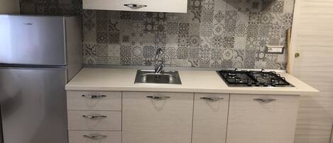 Microwave, oven, coffee/tea maker, cookware/dishes/utensils