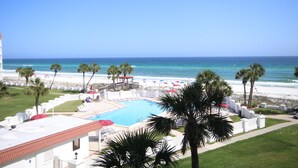 A pool area with a view of the beach and ocean. - El Matador 444 -  FREE TICKETS!! Your stay includes free tickets to many area attractions! (Fort Walton Beach)