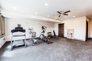 A gym with various exercise equipment including treadmills, stationary bikes, and weight machines. - Blackstone 2BR/2.5BA | Two King Suites | Pool & Hot Tub | Canyons Village (Park City)