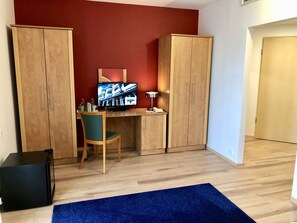 Deluxe Double Room, Balcony | Living area | TV
