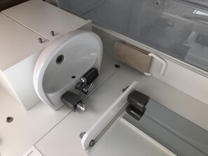 Combined shower/bathtub, hair dryer, towels, toilet paper