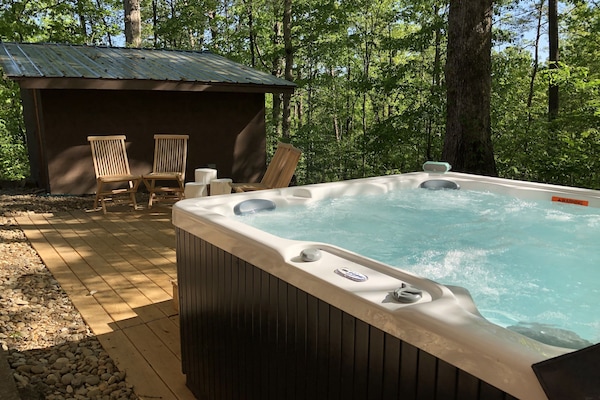 Hot tub, deck and sauna in the background