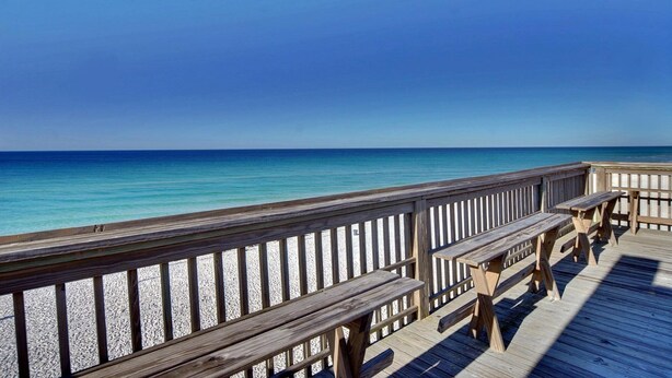 A wooden pier with benches overlooking a beach and the ocean. - Surfside 803 - Gulf View, Community Pool, Hot Tub, Tennis, Easy Beach Walkover! (Miramar Beach)