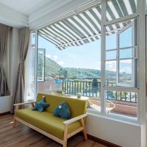 Habitación doble superior | Zona de estar