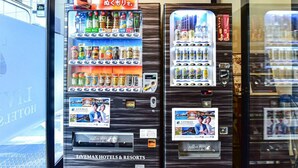 A vending machine with various beverages and snacks, and a Livemax Hotels & Resorts sign. - Hotel Livemax Hakata Nakasu (Fukuoka)