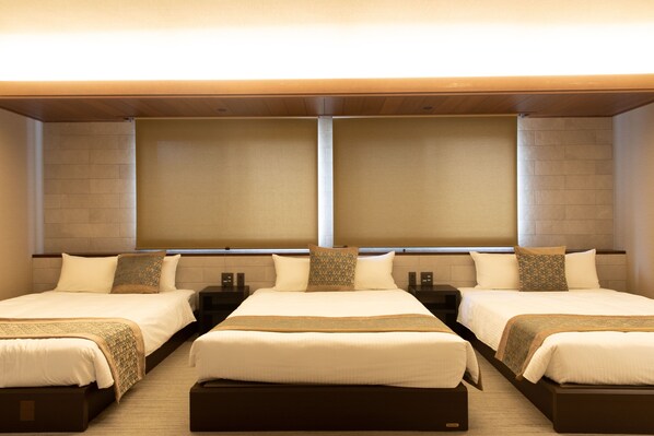 A hotel room with two beds, a large window, and a wooden ceiling. - GRAND BASE Nagoya Ekinishi (Nagoya)
