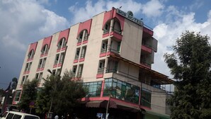 A multi-story building with a prominent sign reading "SGS HOTEL". - SGS Hotel (Addis Ababa)