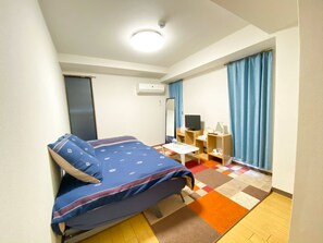 Apartment, 1 Bedroom | Desk, blackout curtains, iron/ironing board, free WiFi
