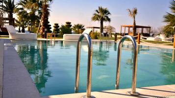 Seasonal outdoor pool, open 7:30 AM to 7:30 PM, pool cabanas (surcharge)